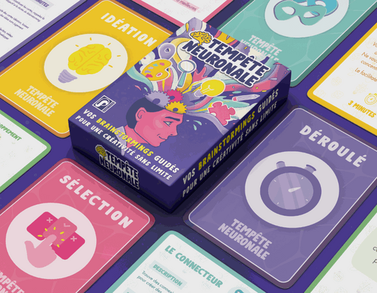 Boite du jeu Tempête Neuronale entourée des cartes qui composent le jeu