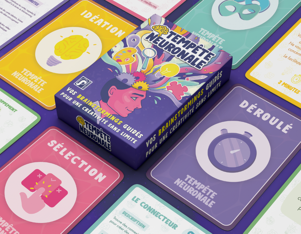 Boite du jeu Tempête Neuronale entourée des cartes qui composent le jeu